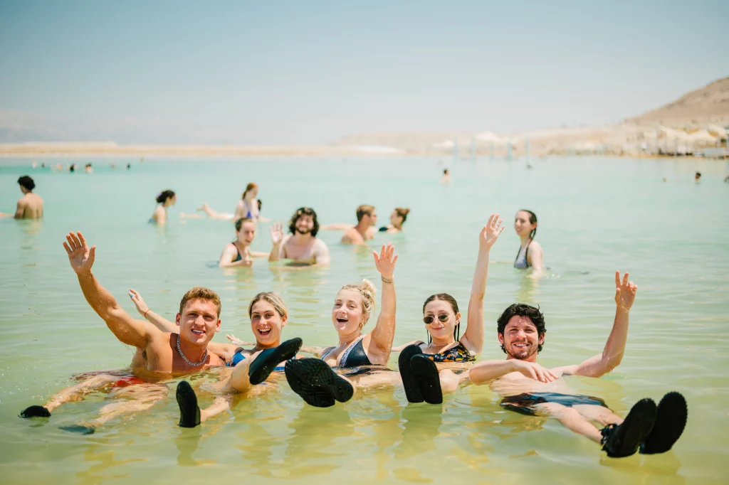 Students exploring Israel in the Dead Sea