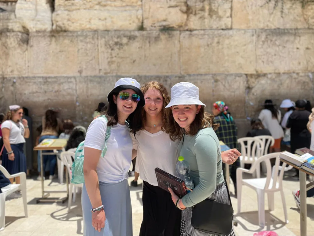 Jayne Samborn and friends in Israel on an NCSY trip, standing in front of the Western Wall.